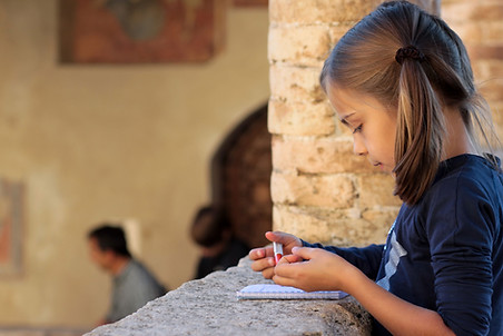 Girl Writing on Notebook